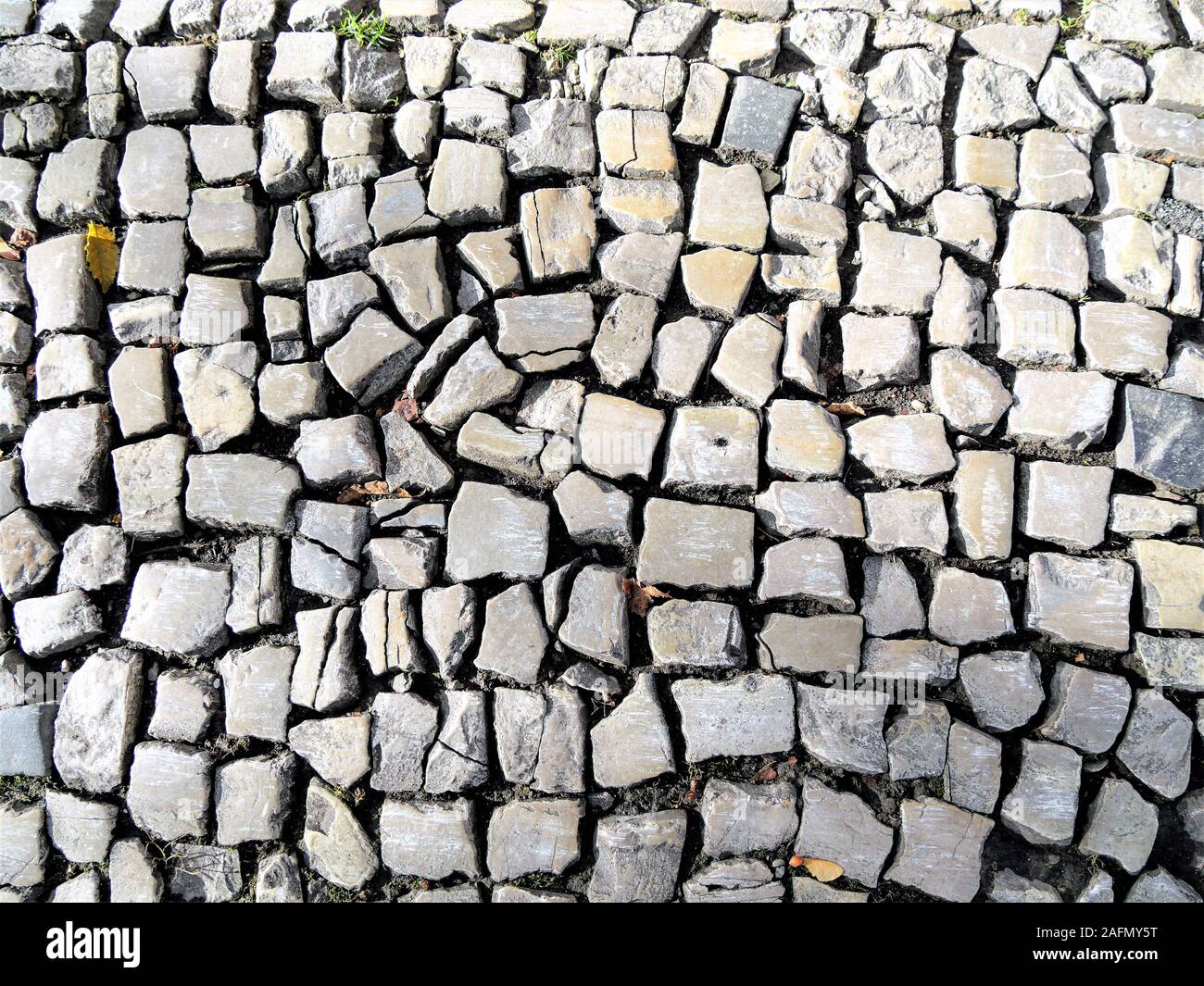 Eine antik alte Pflaster mit viel Kopfsteinpflaster Stockfoto