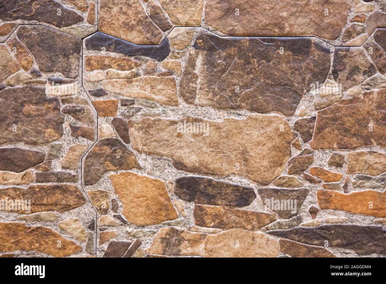 Der Pebble Stone Fußboden und Wand, Hintergrund Texturen. Warme Farbtöne. Stockfoto
