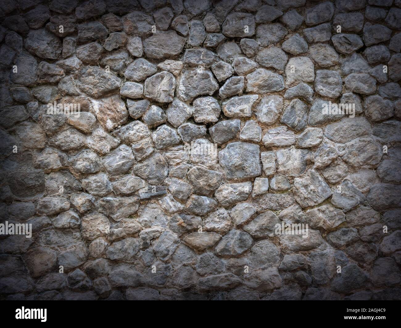 Dunklen stein Wand Hintergrund mit Vignette Stockfoto