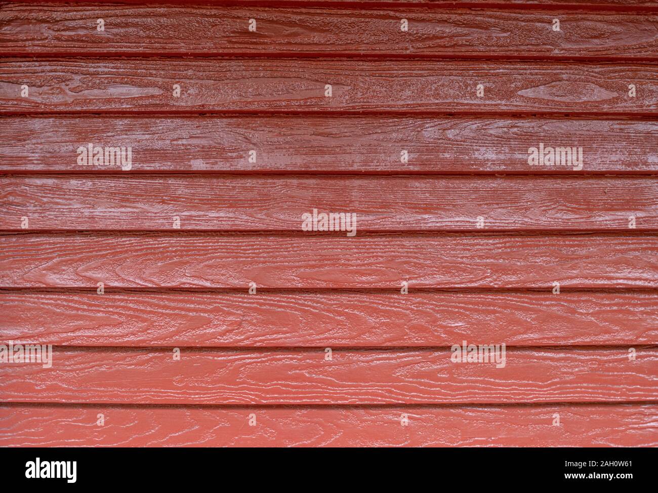 Ein Hintergrund der Roten Schiff lap Siding an einer Wand. Stockfoto