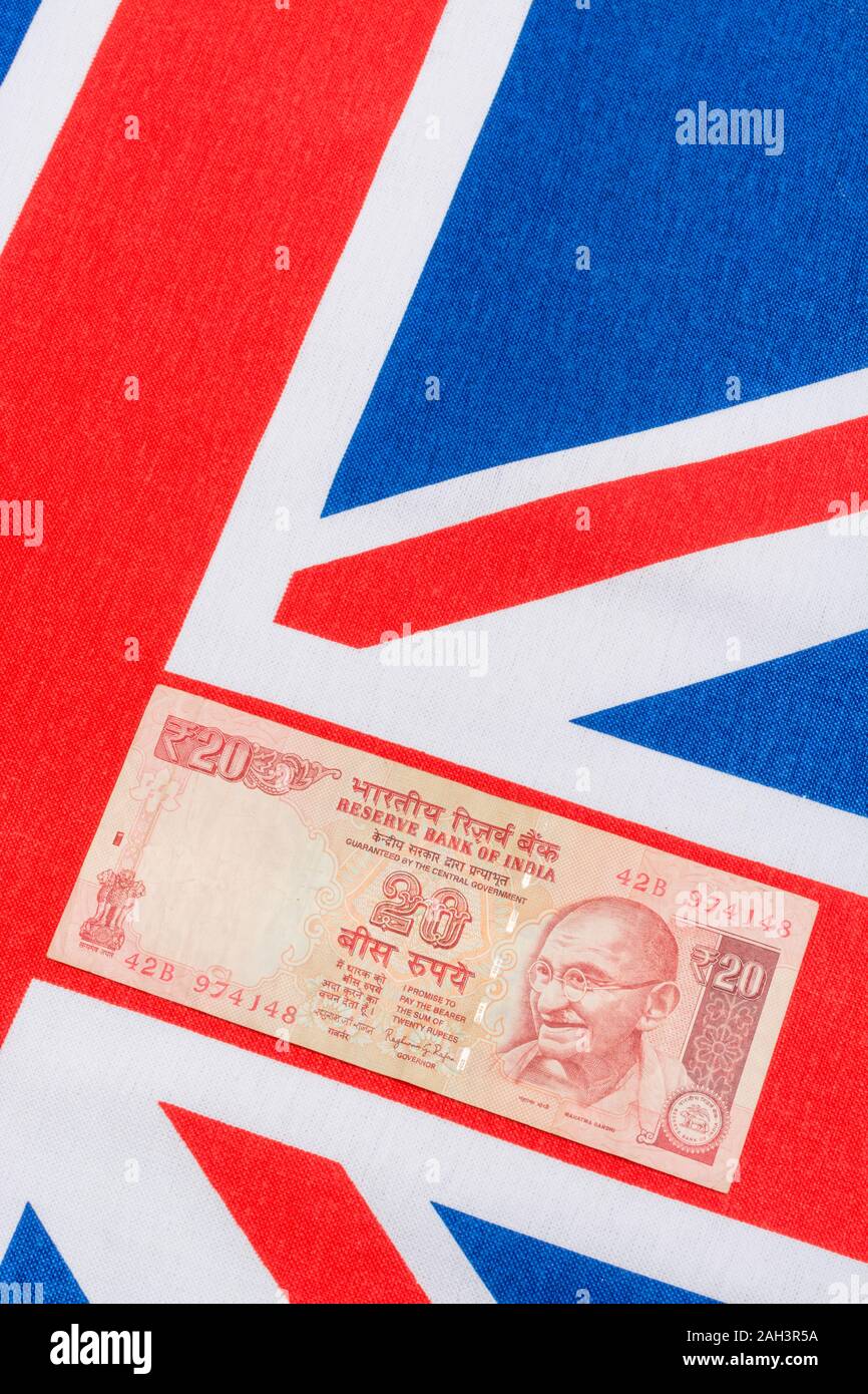 Im alten Stil 20 Indische Rupie Banknoten/Rechnung & Union Jack. Für Indien, Rupie Wechselkurs, Indien Wirtschaft, Indien Großbritannien exportiert, Indien UK Zahlungsbilanz. Stockfoto