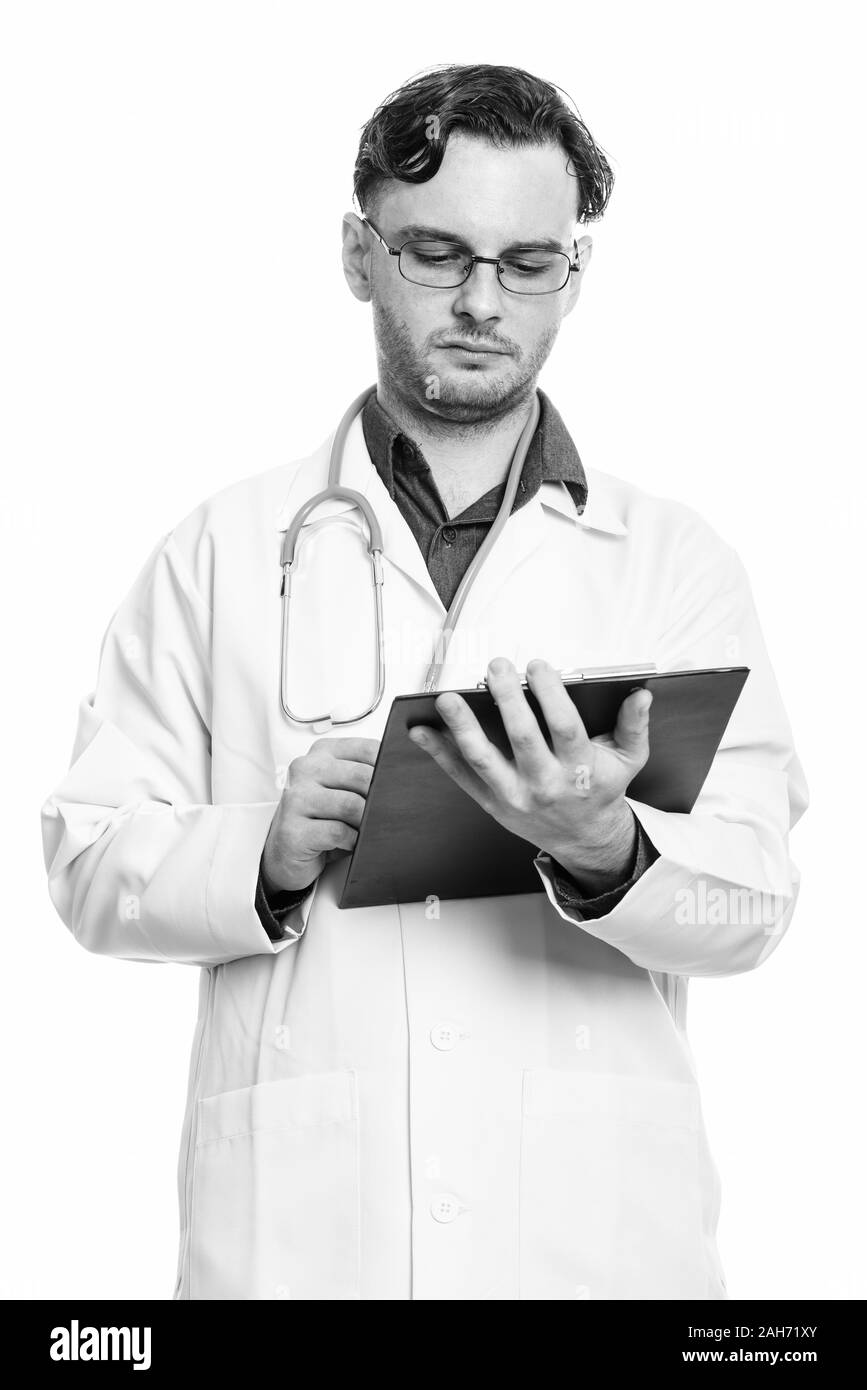 Studio erschossen der junge Mann Doktor Lesung über Zwischenablage Stockfoto