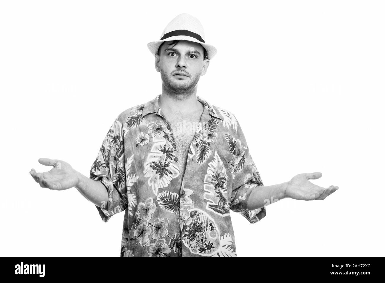 Studioaufnahme des jungen Mannes schauen verwirrt Stockfoto