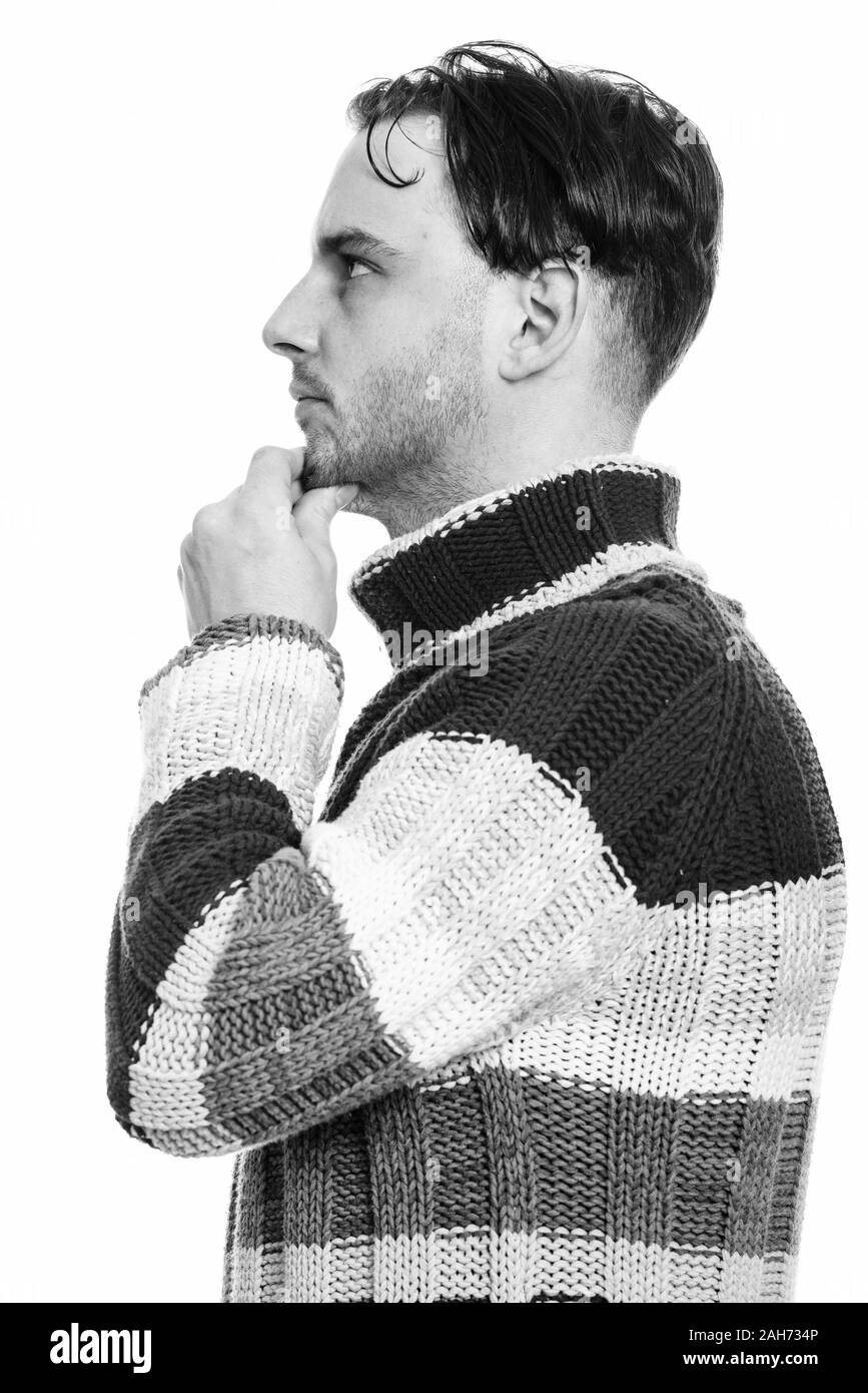Profil anzeigen von jungen Mann denken in Schwarz und Weiß Stockfoto