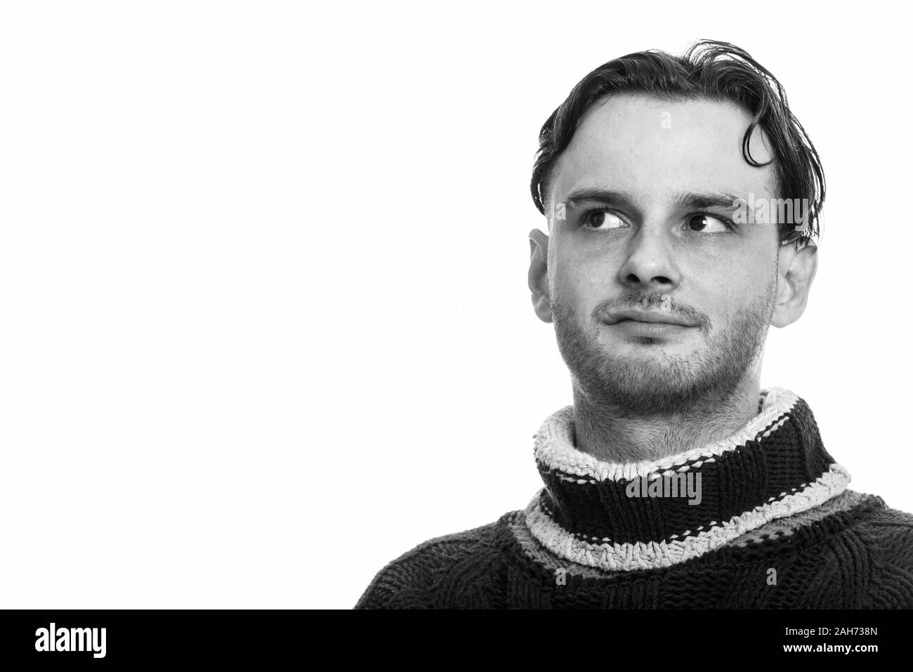 Studio erschossen der junge Mann denken, während die Suche nach Stockfoto