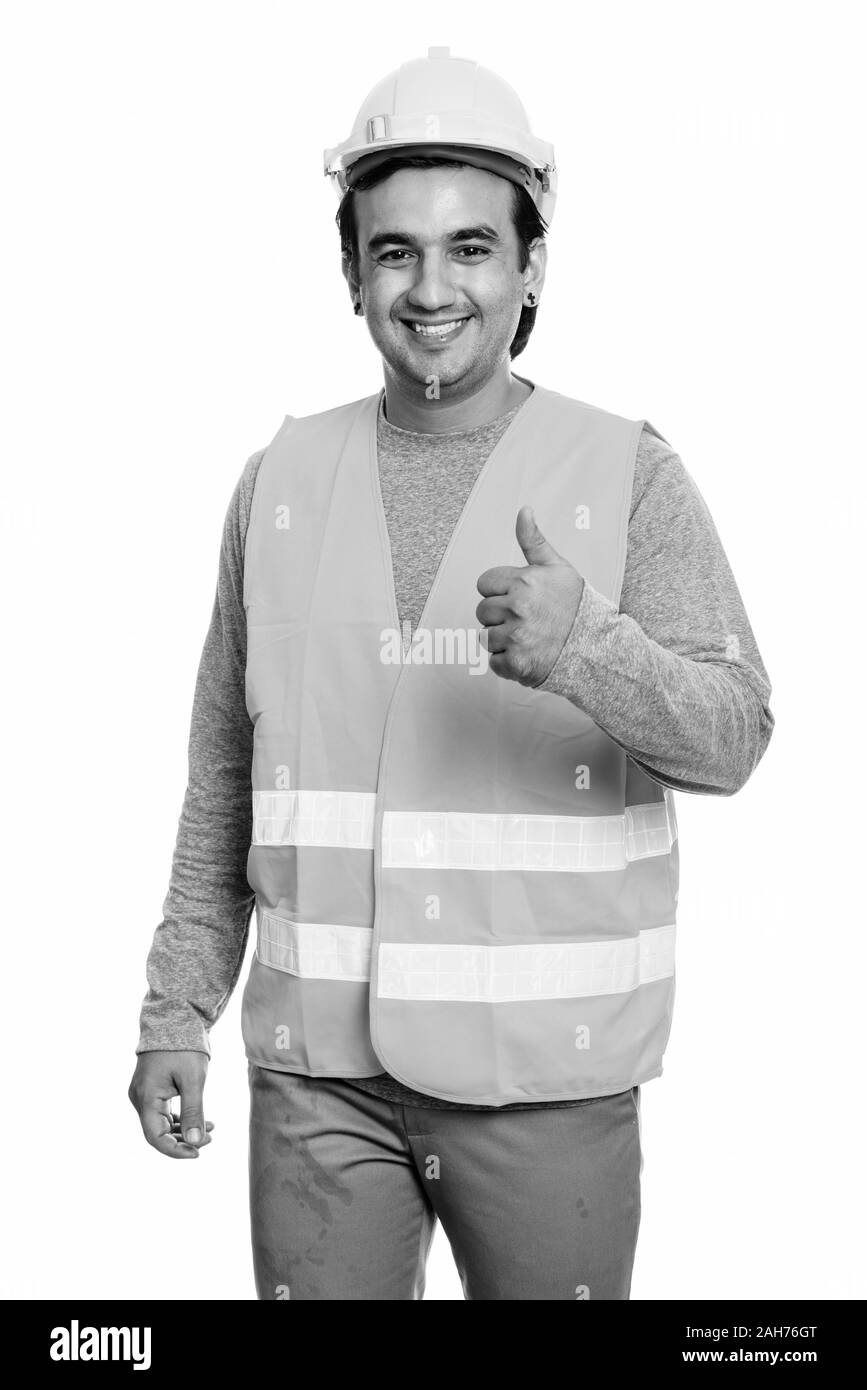 Happy persischen Mann Bauarbeiter lächelnd während Daumen hoch geben Stockfoto