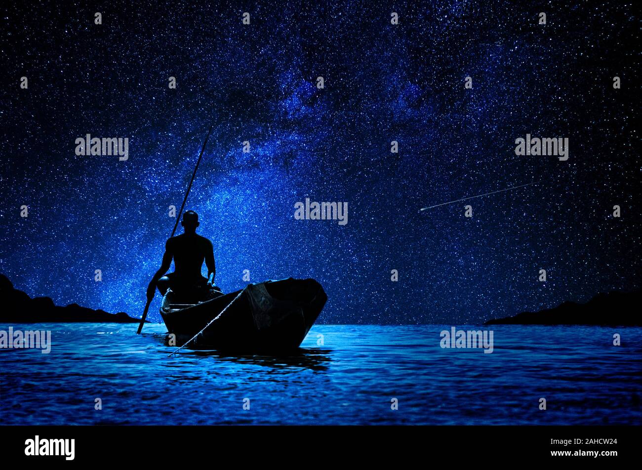 Afrikanischen Schiffer mit seinem Kanu vor der Sterne Stockfoto