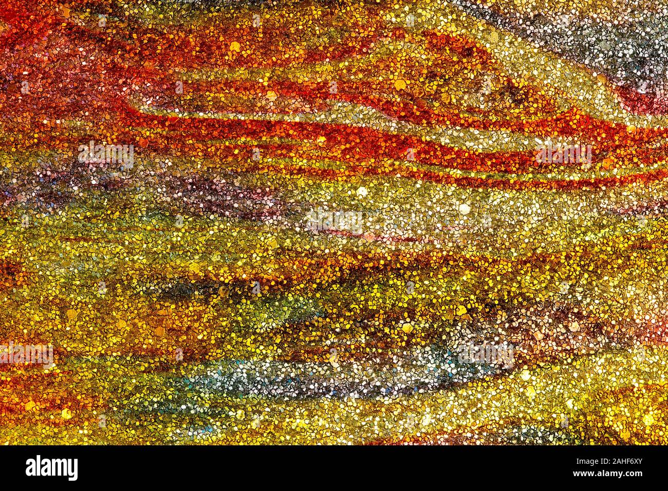 Abstrakte strukturierten Hintergrund von Gold und Orange glitter wirbelt Stockfoto