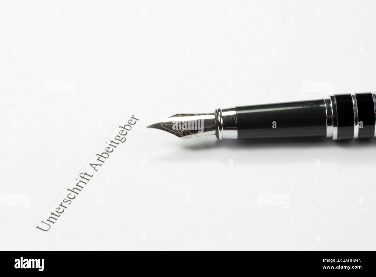 Arbeitsvertrag in Deutschland, Pen und Unterschrift Stockfoto