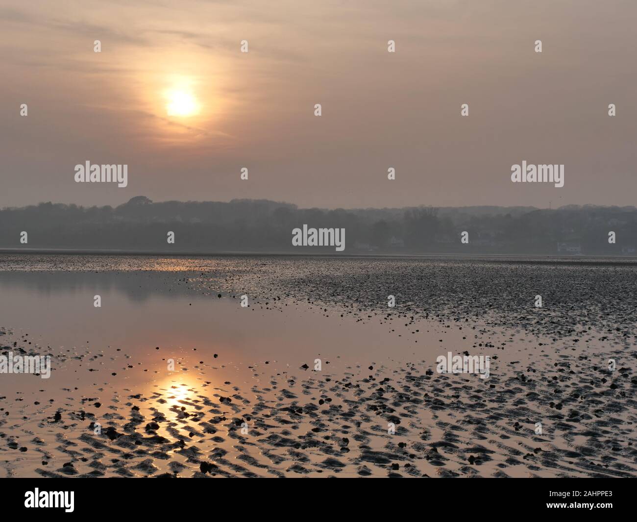 Sonnenuntergang am Roten Wharf Bay, Anglesey, Wales, Großbritannien Stockfoto