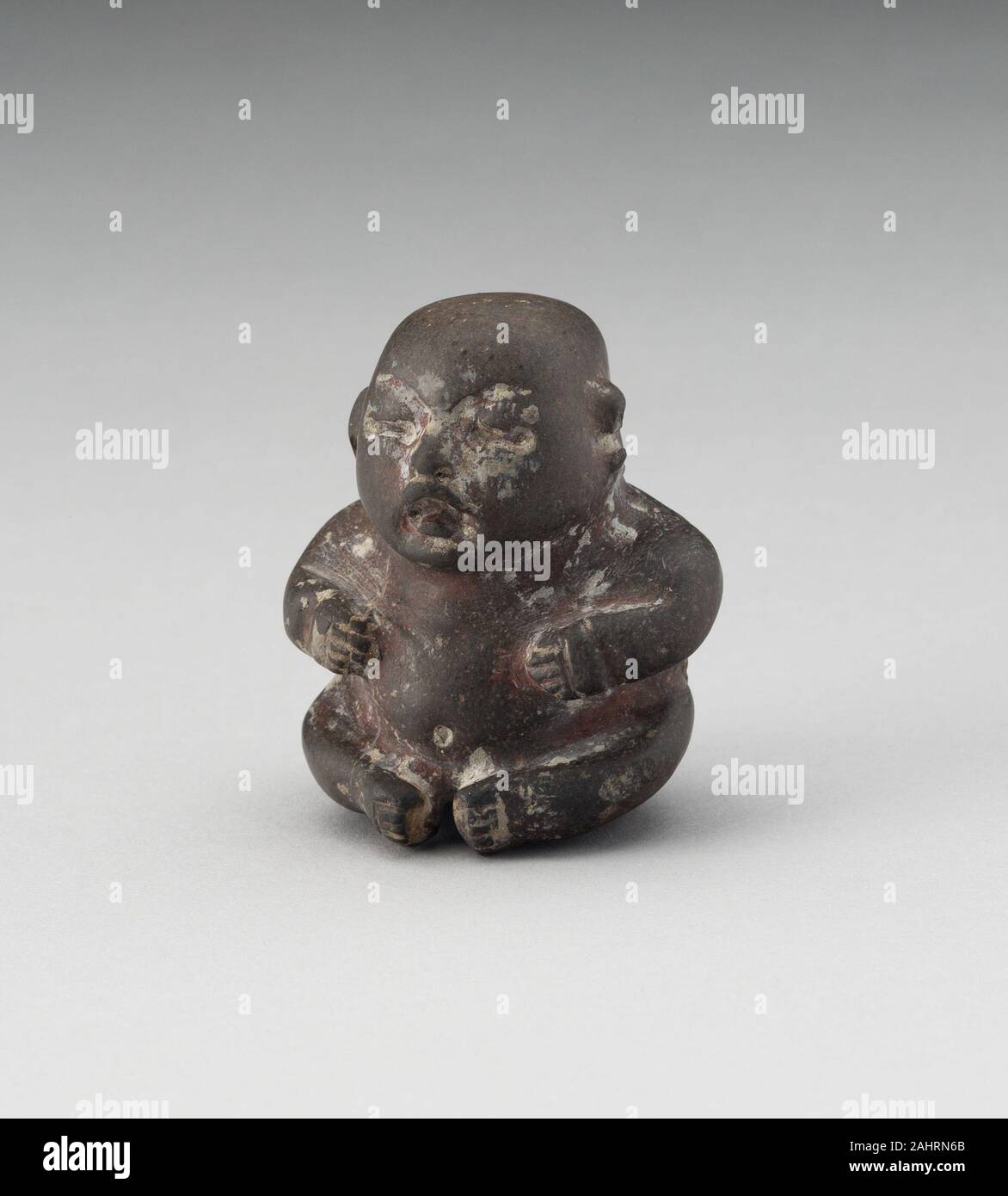 Sitzende Kind-Figur. 1150 BC - 900 BC. México. Stein Stockfoto