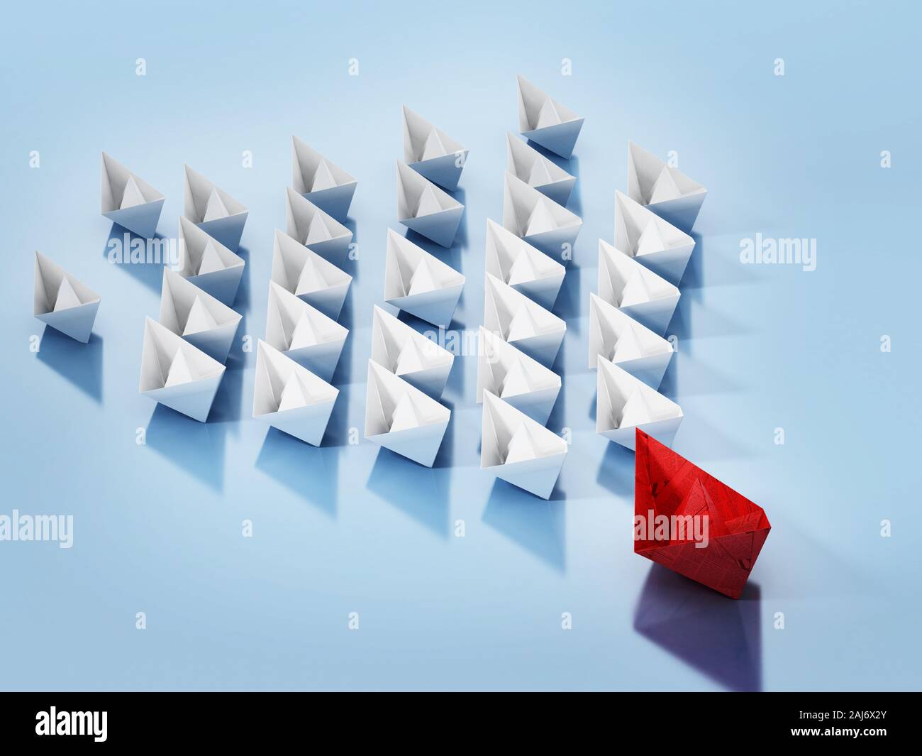 Rotes Papier Schiff führende weißes Normalpapier Schiffe. 3D-Darstellung. Stockfoto