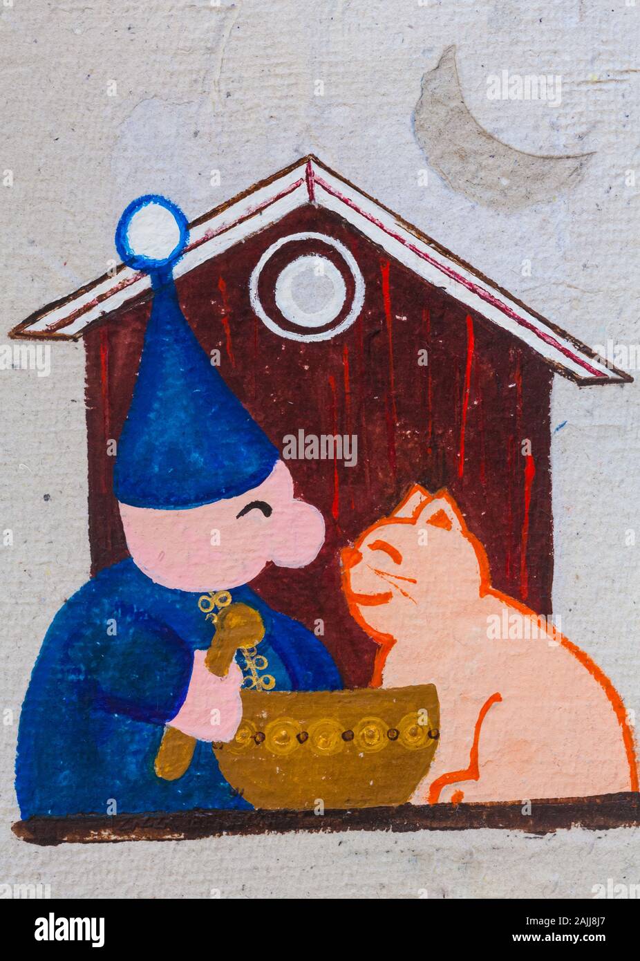 Blauer Weihnachtsmann mit seiner Katze, die Haferbrei aus einer Schüssel isst. Stockfoto