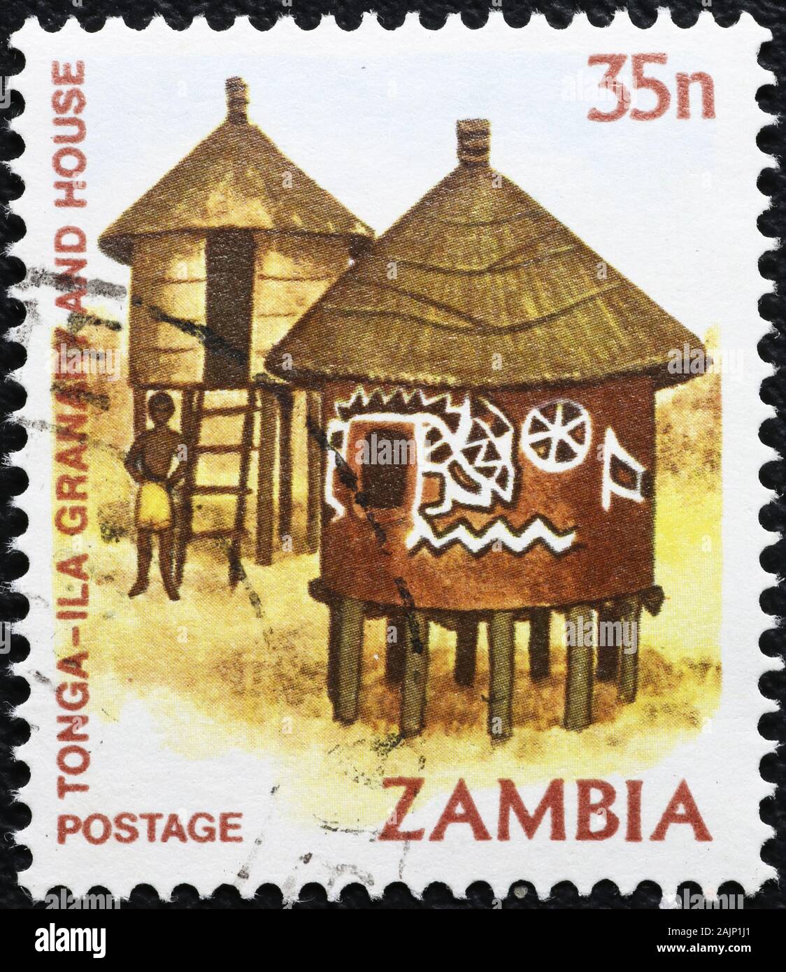 Holzhütten auf sambischen Briefmarke Stockfoto