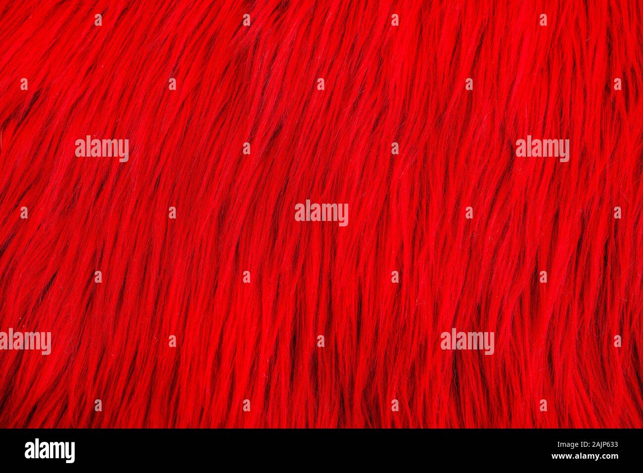 Shaggy Teppich mit Wolle Material für Hintergründe Textur, in der Nähe von Weichen romantischen Pastell rot und flauschig. Stockfoto