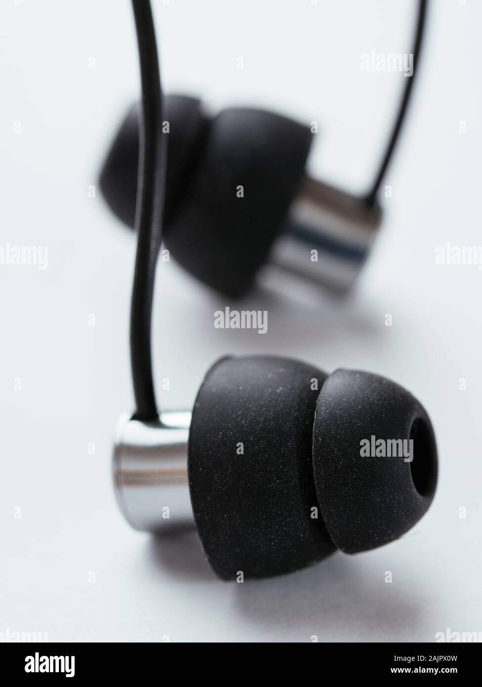 In-Ear Ohrhörer, klein genug, um mit zu schlafen. Stockfoto