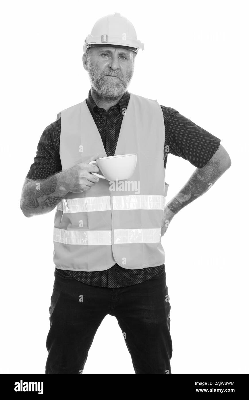 Reife bärtige Mann Bauarbeiter in Kaffeepause Stockfoto