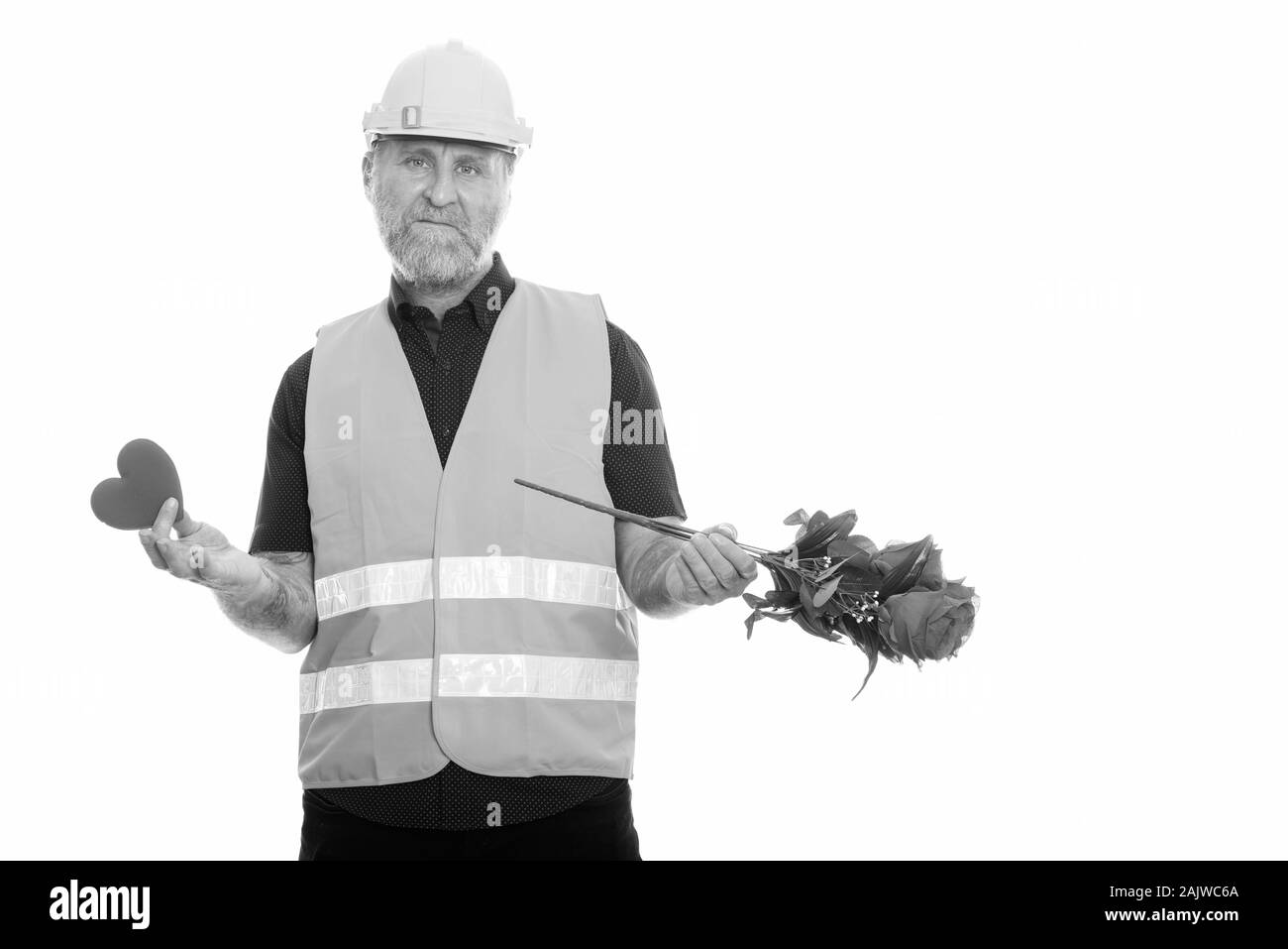 Reife bärtige Mann Bauarbeiter für den Valentinstag bereit Stockfoto