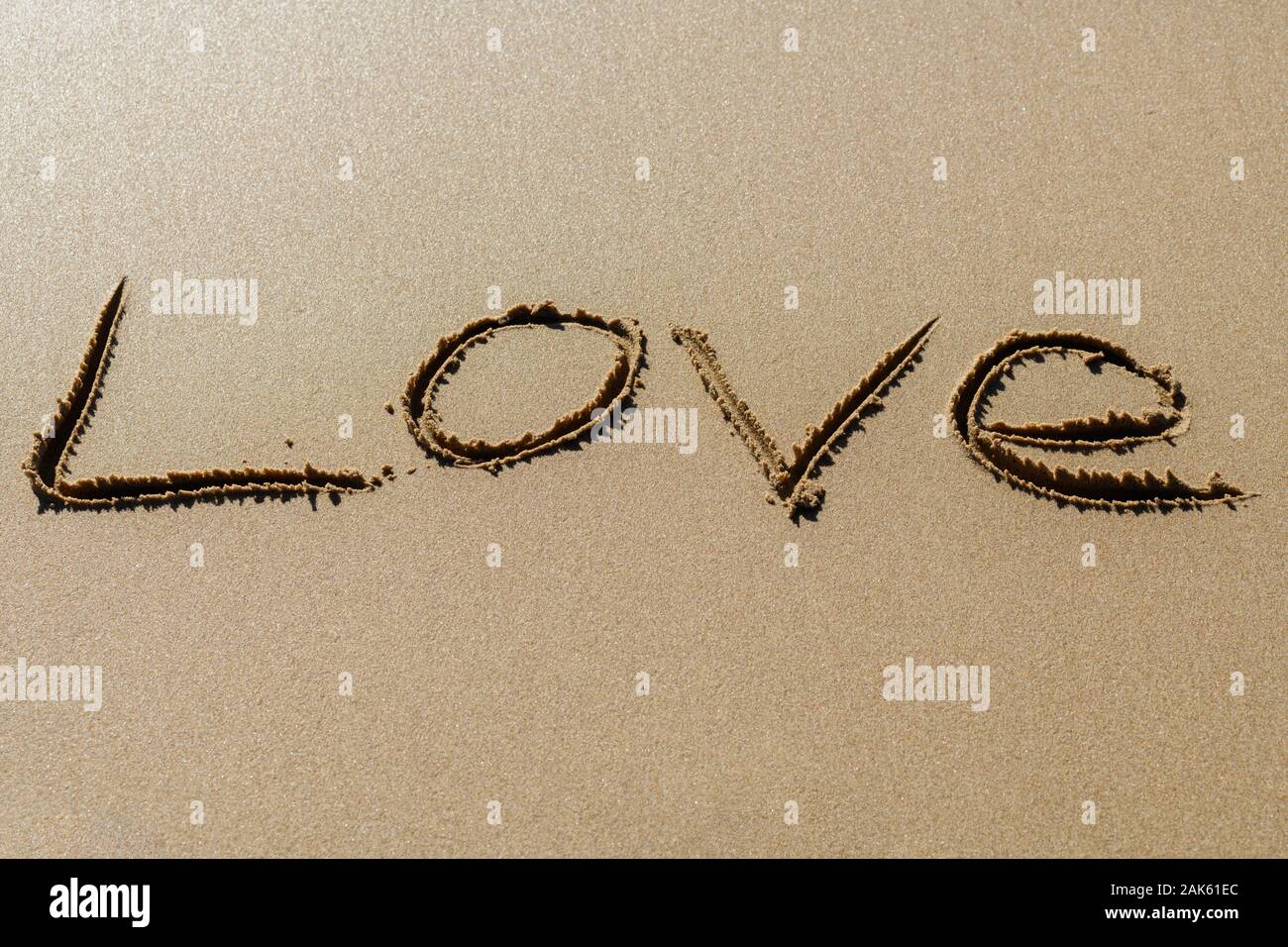 Liebeswörter im Sand Stockfoto