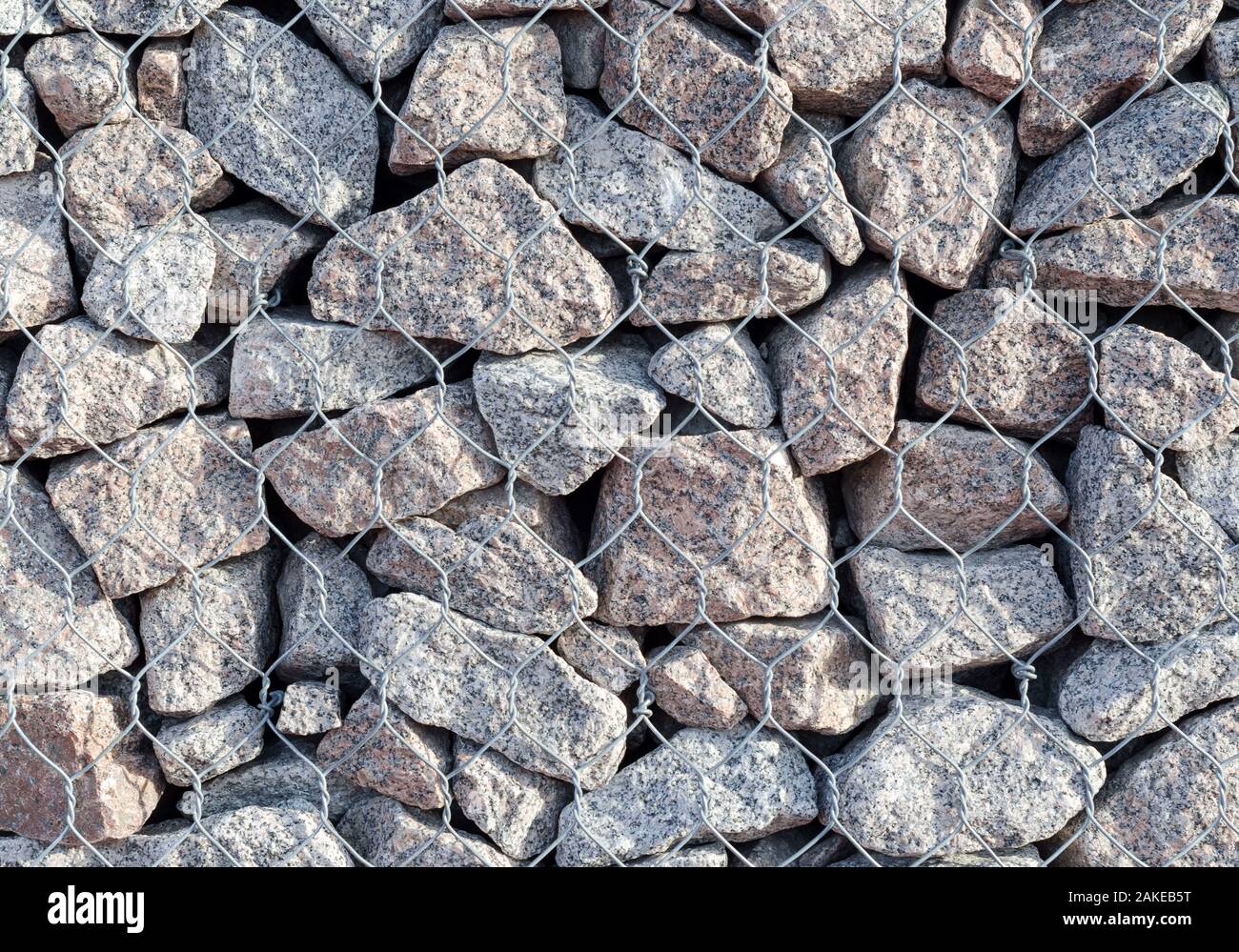 Steinmauer in Gitterrost Textur Hintergrund. Nahaufnahme Stockfoto