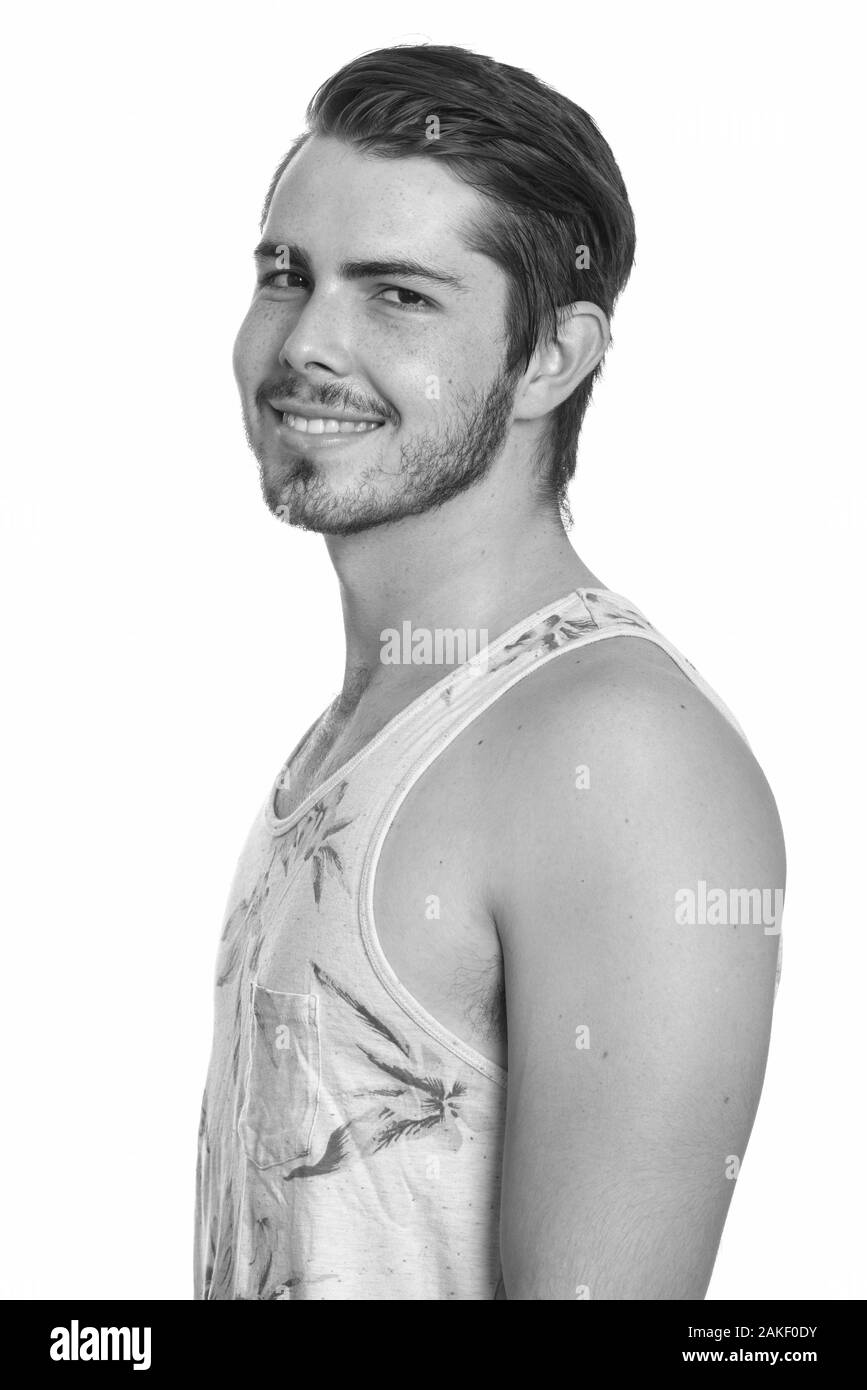 Junger glücklicher kaukasischer Mann bereit für Urlaub Stockfoto Junger glücklicher kaukasischer Mann bereit für Urlaub Stockfoto