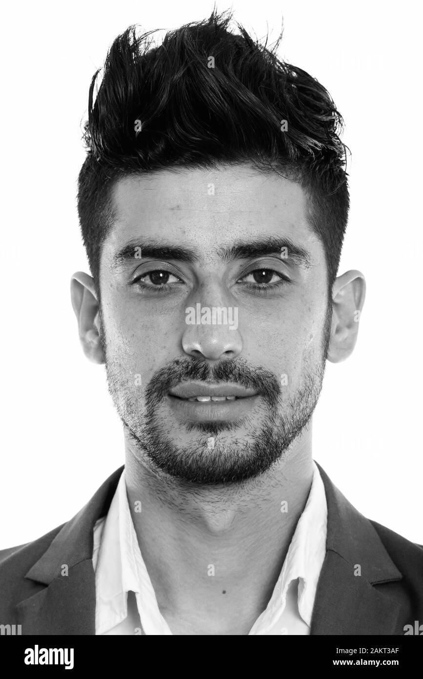 Gesicht der jungen Persischen Geschäftsmann zufrieden lächelnd Stockfoto