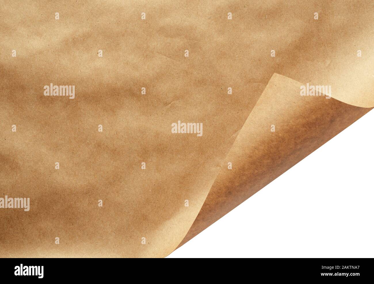 Blatt des Handwerks Papier mit gewellten Ecke isoliert auf weißem Stockfoto