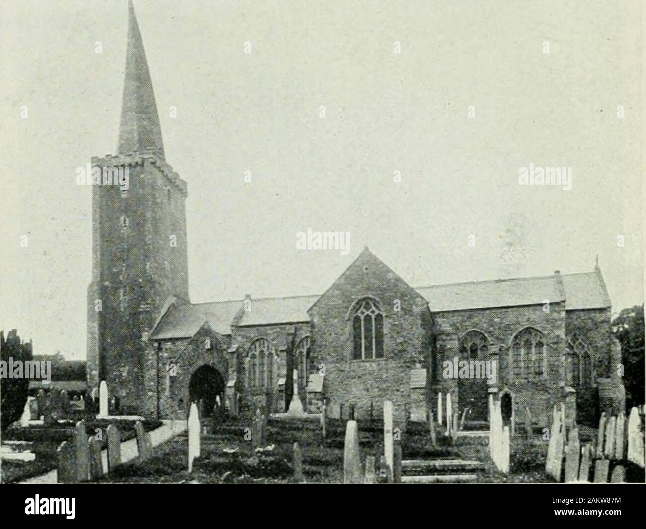 Eine bildhafte und anschauliche Anleitung zu Plymouth, Stonehouse und Devonport mit Exkursionen durch Fluss, Straße und Meer. F. Frith & Co., Ltd.,] [Reigate. ERMINGTON KIRCHE MIT IHREN verdrehten Turm. Stockfoto