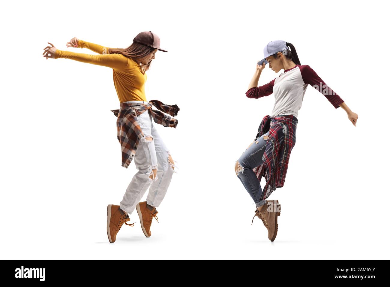 Volle Länge Profil Schuß von zwei jungen Frauen tanzen Street Dance Stil auf weißem Hintergrund Stockfoto