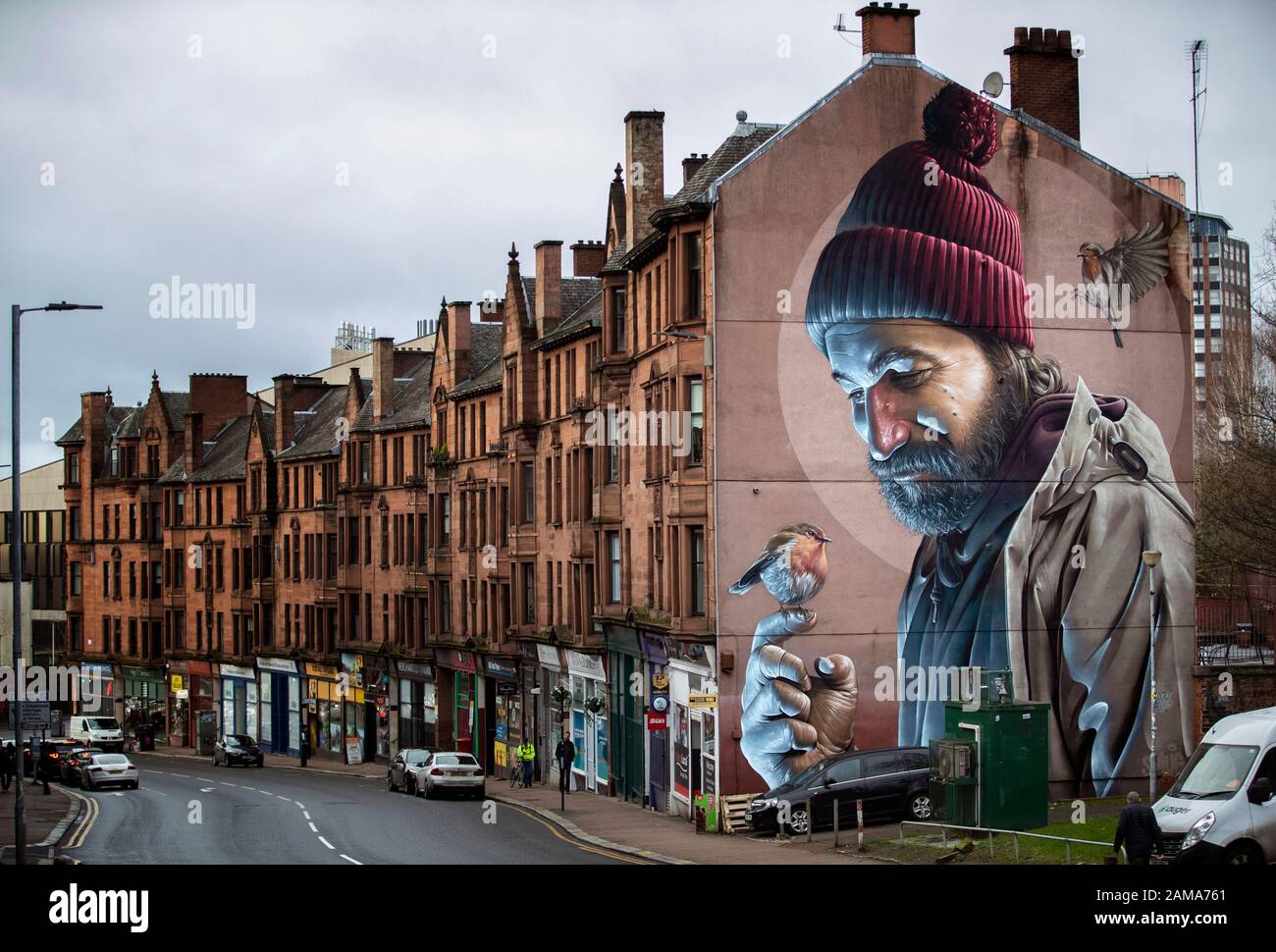 Eine der bekanntesten Wandbilder Glasgows, von Straßenkünstler Smug, stellt einen modernen St Mungo dar, der auf die Geschichte des Vogels Verweist, Der Nie Flog. Der 13. Januar ist der Festtag von St. Mungo, der der Schutzpatron und Gründer der Stadt Glasgow ist. Stockfoto