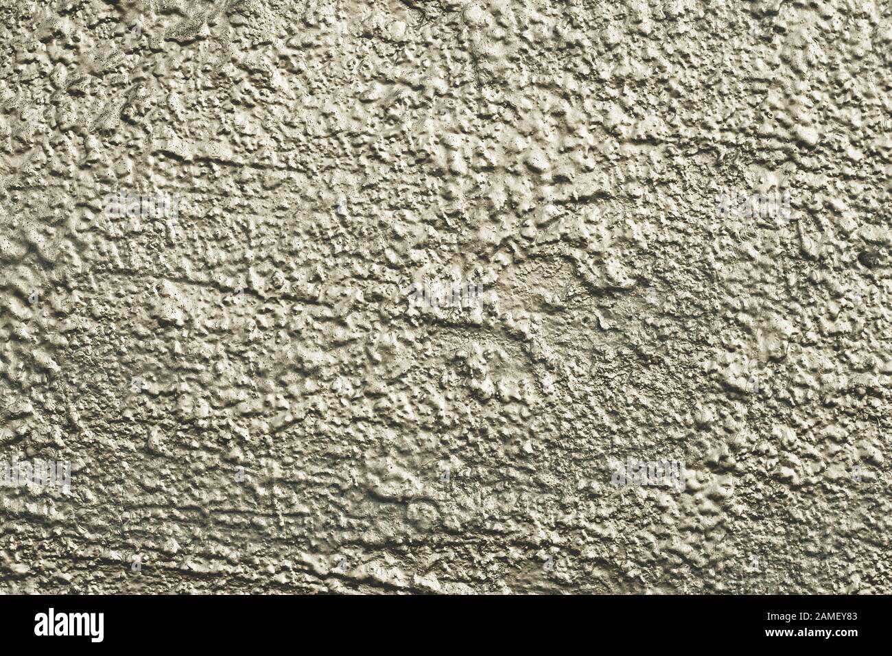 Natürliches Muster einer bemalten Wand. Grüne und graue Betonoberfläche. Strukturierter Hintergrund der städtischen Außenfassade, Stuck. Abstrakt glänzende Architekturkulisse, Stockfoto