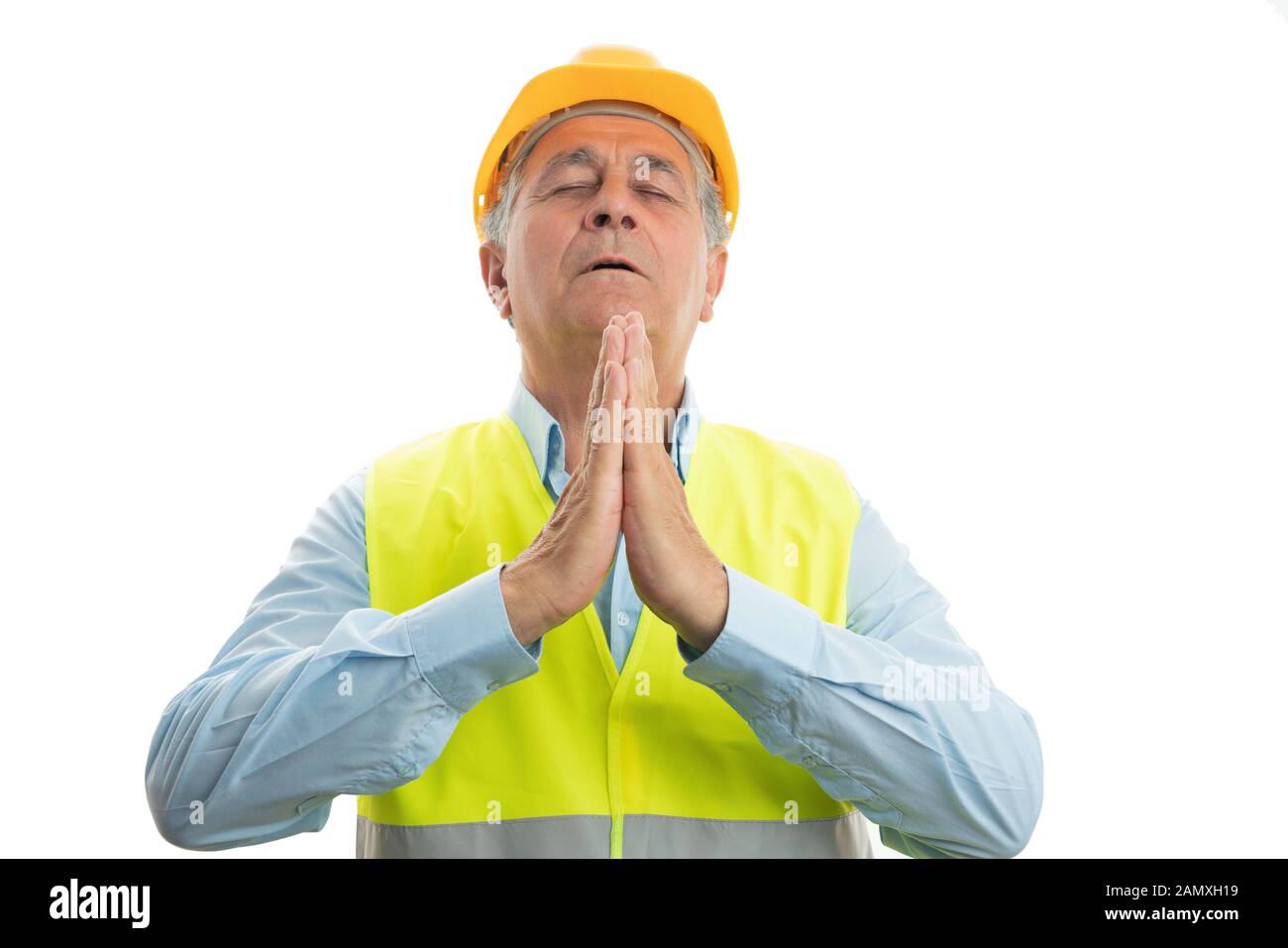 Alten männlichen Builder mit Händen zusammen beten und glauben Konzept auf weißem studio Hintergrund isoliert Stockfoto