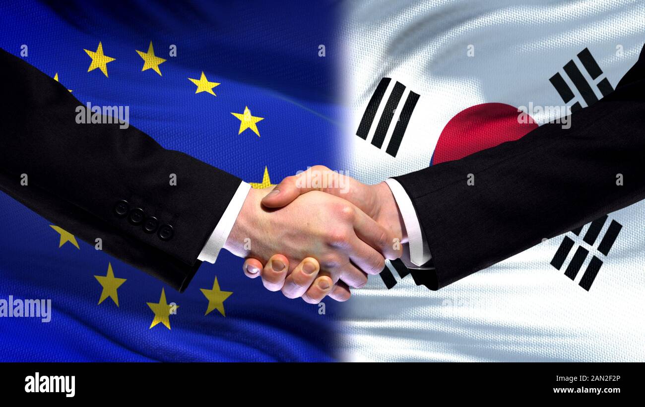 EU und Südkorea Handshake, internationale Freundschaft Beziehungen Flagge Hintergrund Stockfoto
