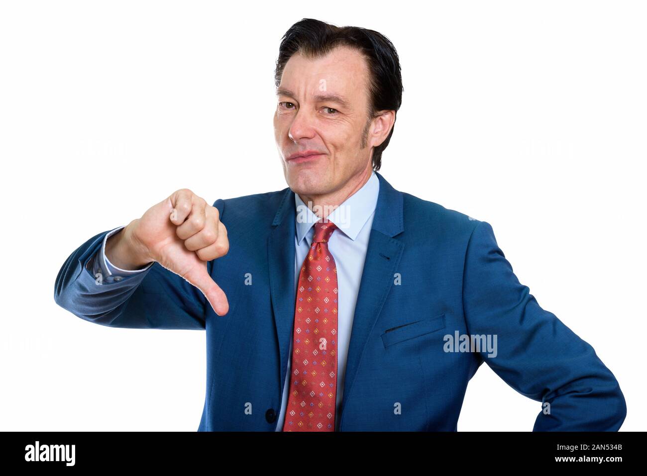 Studio shot reifer Geschäftsmann geben Daumen betonte nach unten Stockfoto