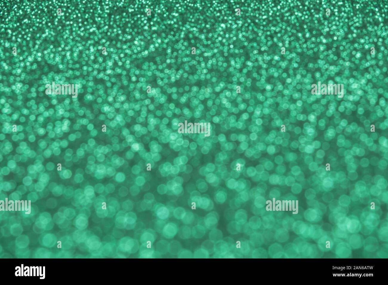 Schönen grünen Hintergrund unscharf, Pailletten und Glitter Stockfoto