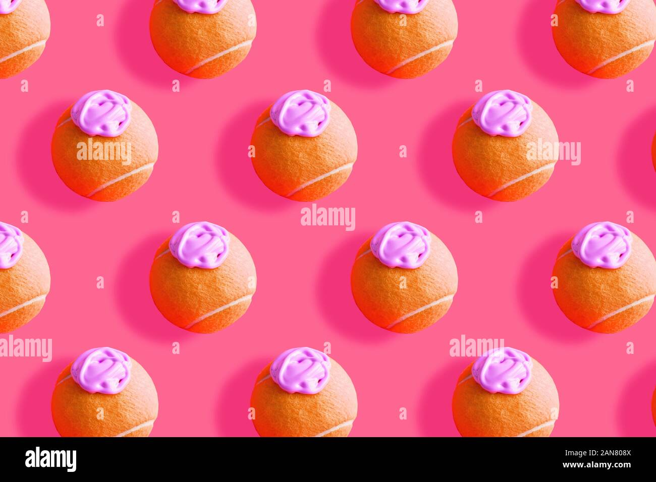 Orange Tennis ball Pattern mit rosa Farbe Stockfoto
