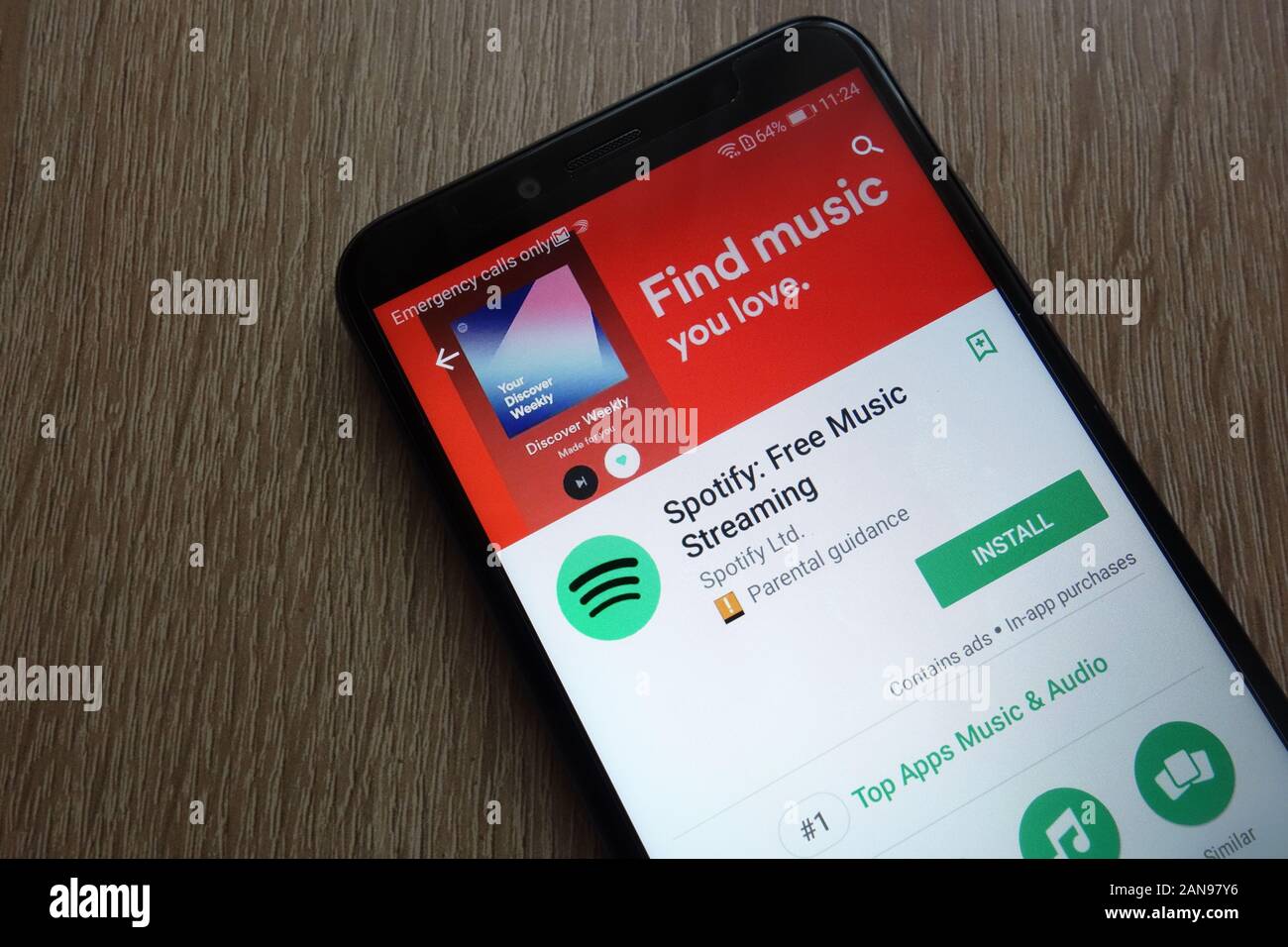 Spotify-App auf der Google Play Store-Website auf einem modernen Smartphone angezeigt Stockfoto