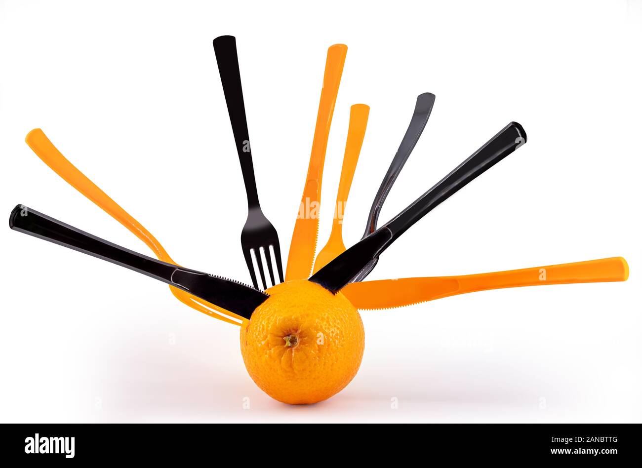 Frische orange Frucht mit Gabeln und Messer klemmt in der it Stockfoto