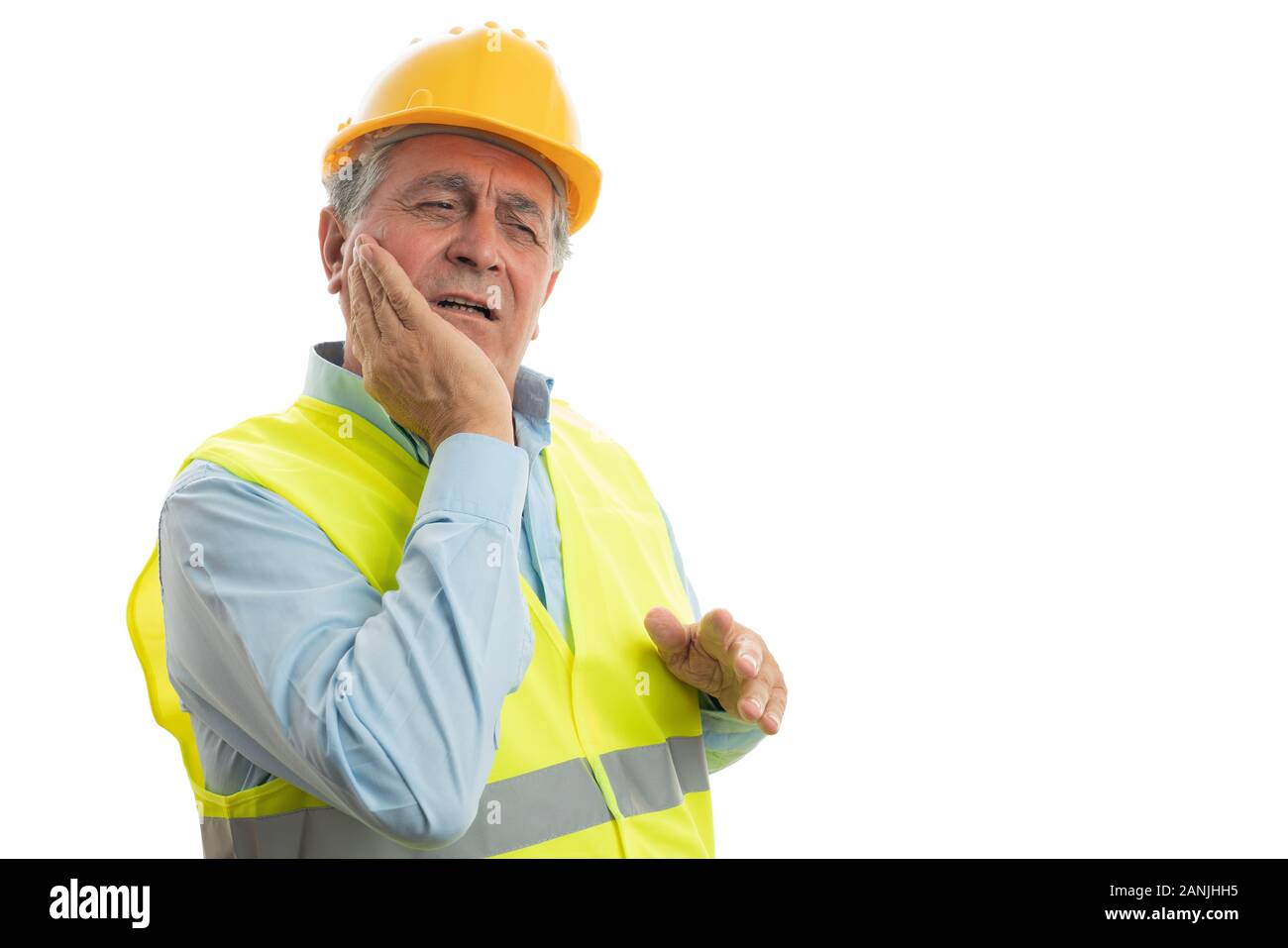 Builder Mann Gesicht zu berühren wie Zahnschmerzen Konzept mit verletzten Ausdruck auf weißem Hintergrund Stockfoto