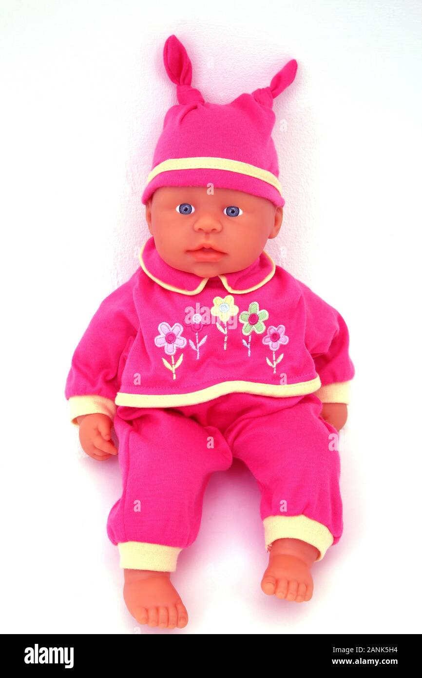 Weichen Körper Spielzeug Baby tragen rosa Outfit und Hut Stockfoto