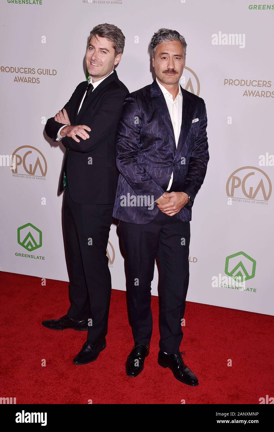 HOLLYWOOD, CA - 18. Januar: carthew Neal (L) und Taika Waititi nehmen an der 31. jährlichen Producers Guild Awards im Hollywood Palladium am 18. Januar 2020 in Los Angeles, Kalifornien. Stockfoto