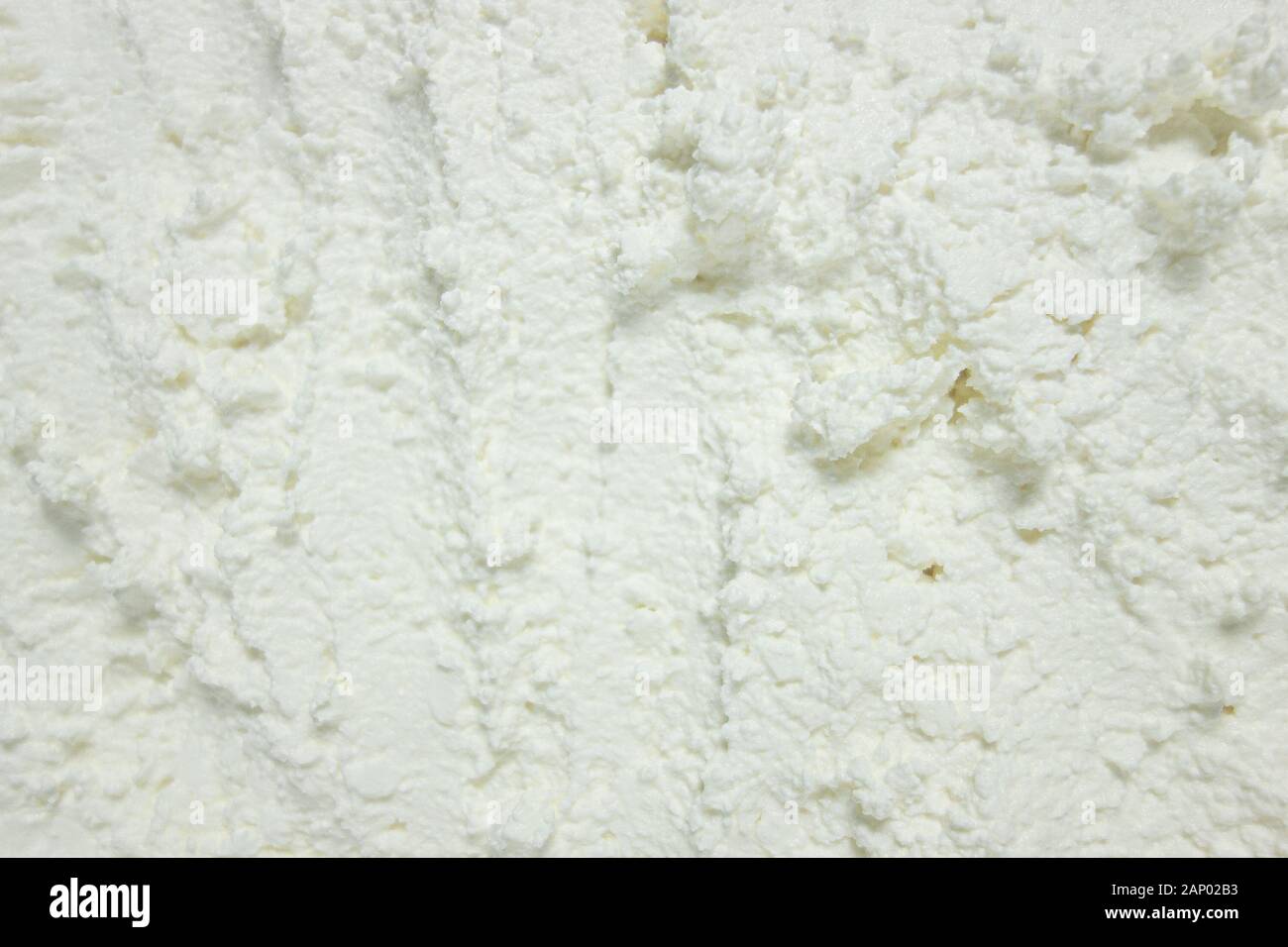 Strukturierte weiße Substanz Hintergrund. Schaum Konsistenz Hintergrund Detailansicht Eis, Baumwolle Käse oder Schnee wie. Mock-up oder für Design Schablone b Stockfoto