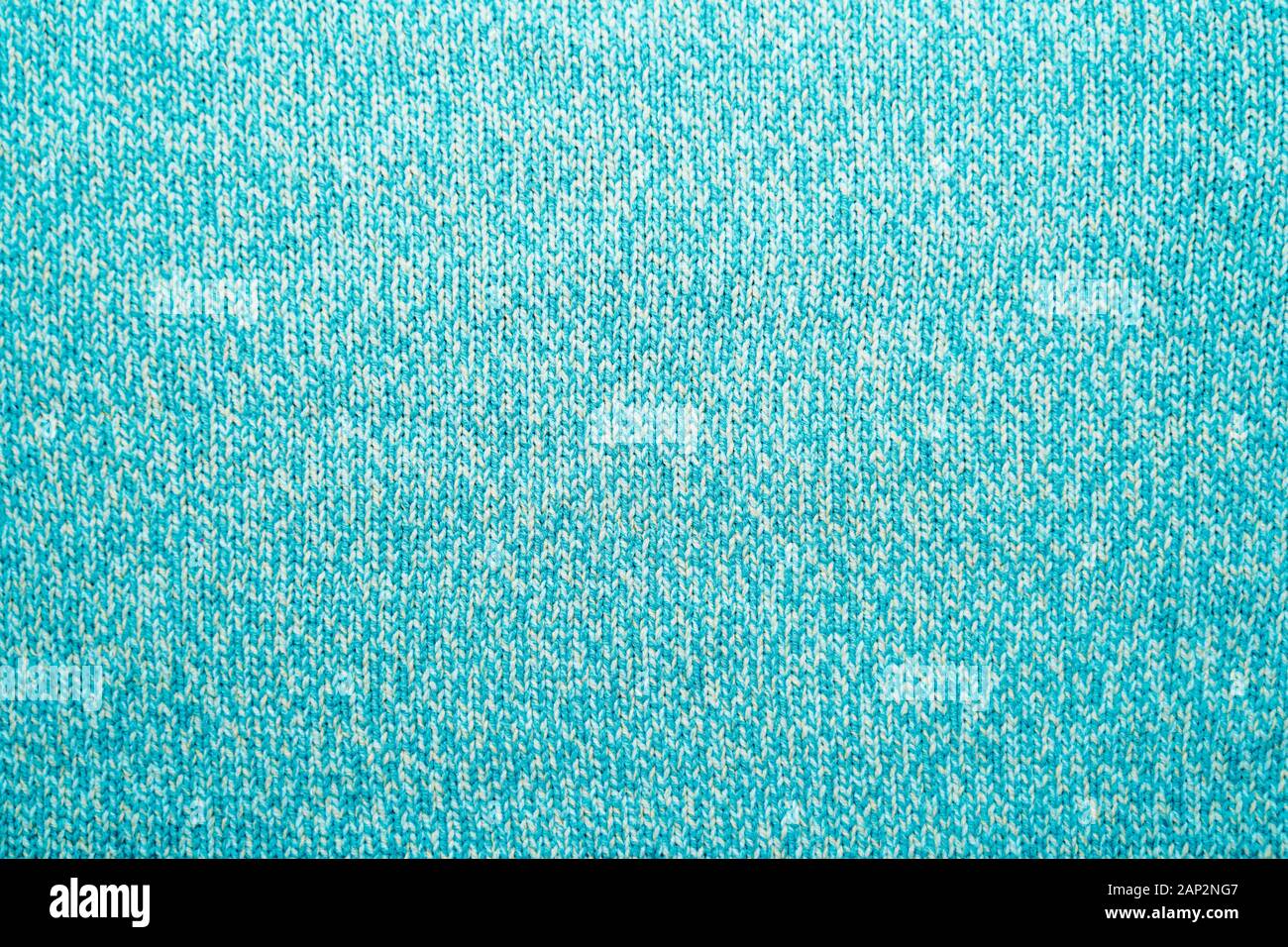 Die Textur einer blau türkis Gestrick. Pullover Hintergrund Stockfoto