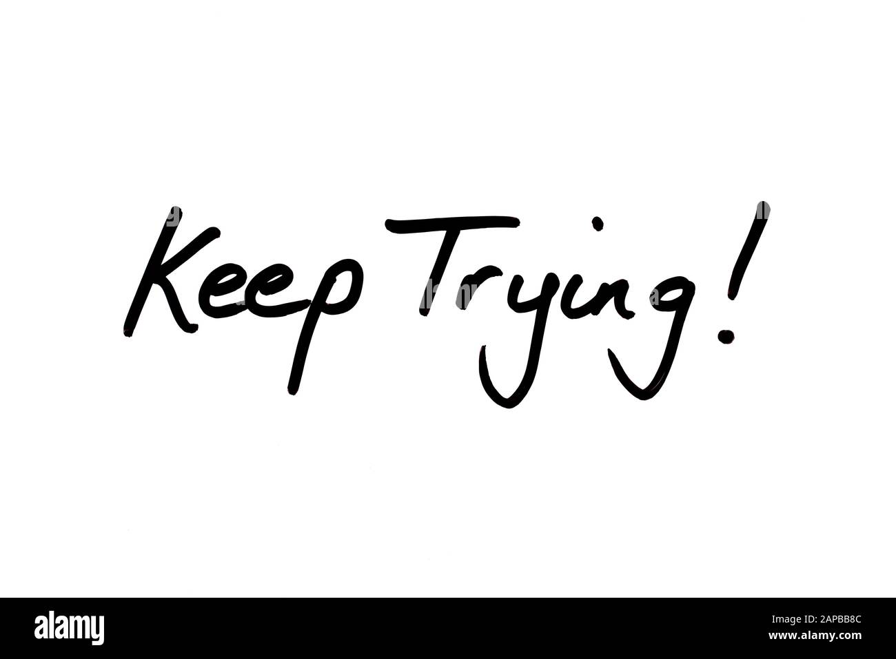 Nahaufnahme eines Versuchs! Nachricht handschriftlich auf weißem Hintergrund. Stockfoto
