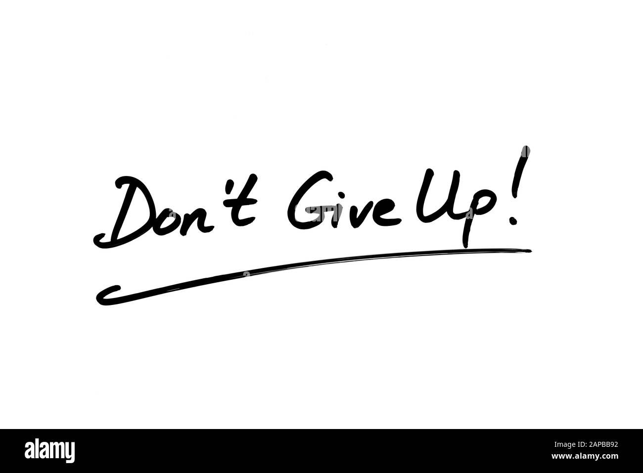 Nahaufnahme eines Don't Give Up! Nachricht handschriftlich auf weißem Hintergrund. Stockfoto