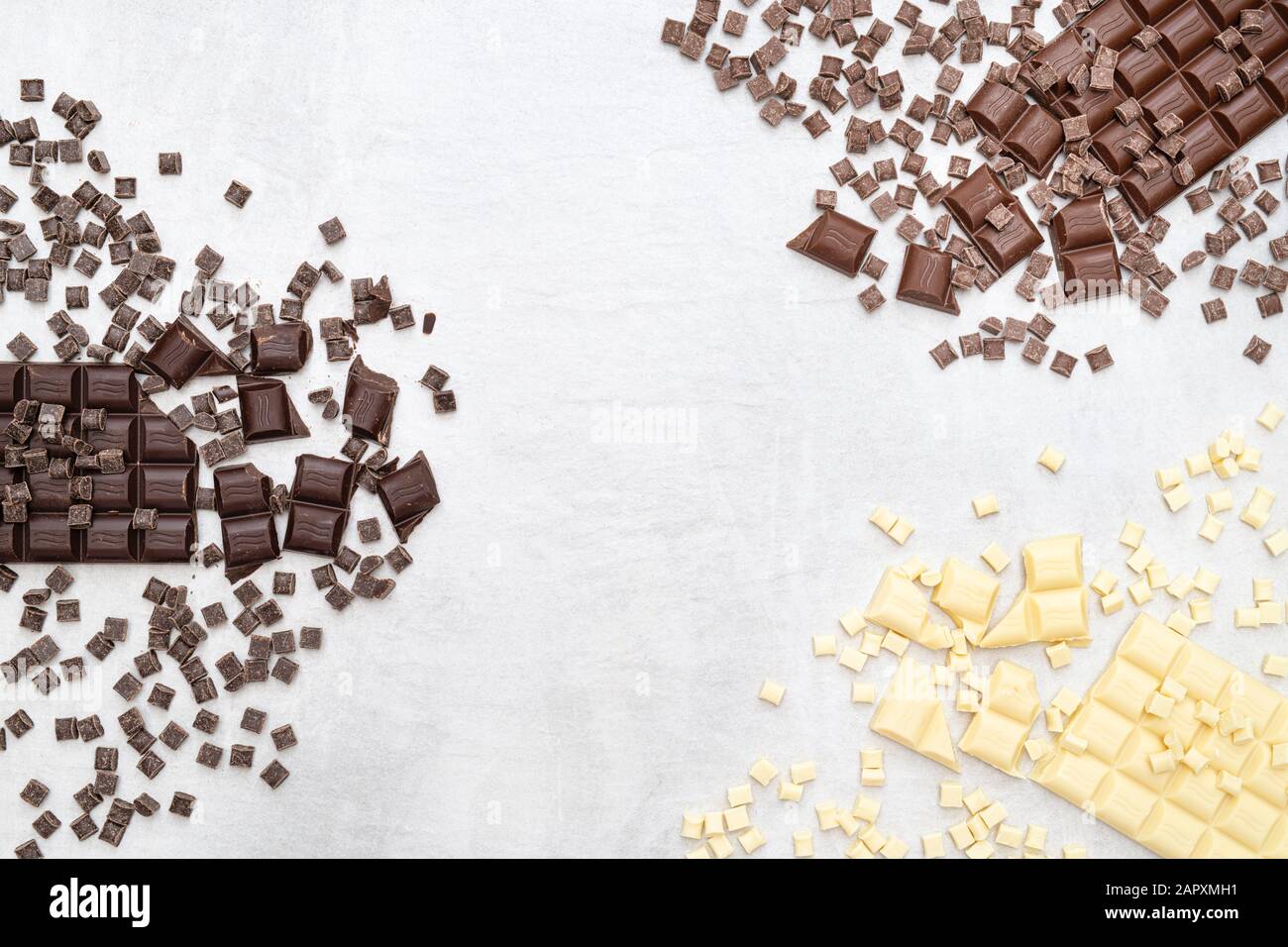 Verschiedene Milchstäbchen, dunkle und weiße Schokoladenmuster Stockfoto