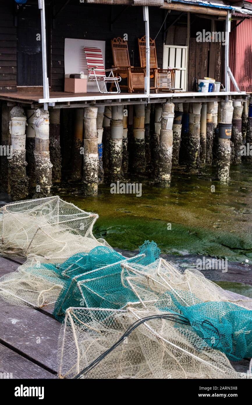 Clan Jetty Penang - das Gebiet, in dem die Clan-Stege in Penang einst mit Holzbohlen und Brennholz übersät waren. Einheimische sammelten die Planken und Konstrus Stockfoto