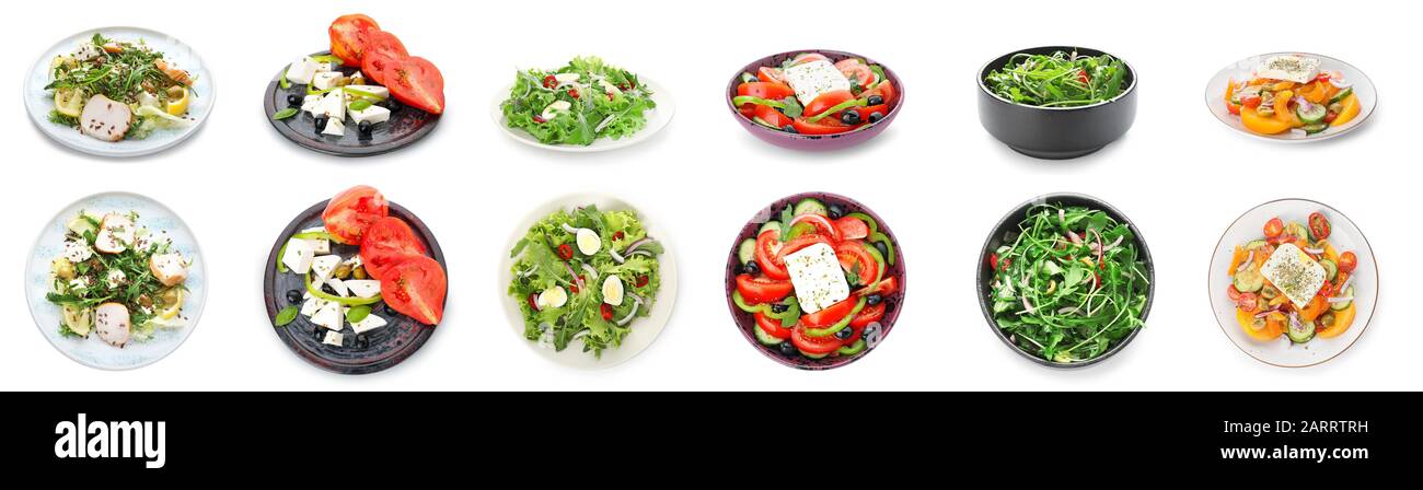 Verschiedene leckere Salate auf weißem Hintergrund Stockfoto