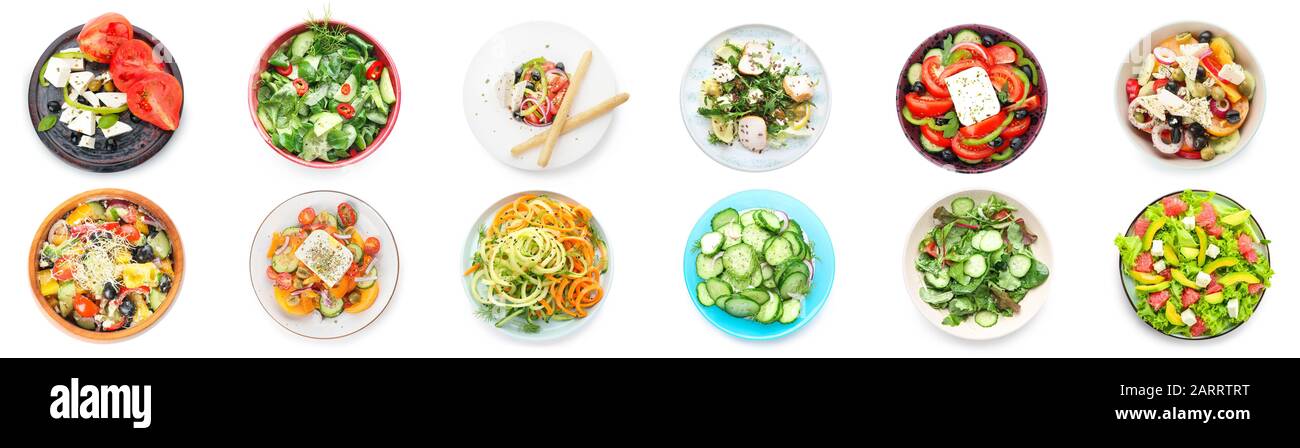Verschiedene leckere Salate auf weißem Hintergrund Stockfoto