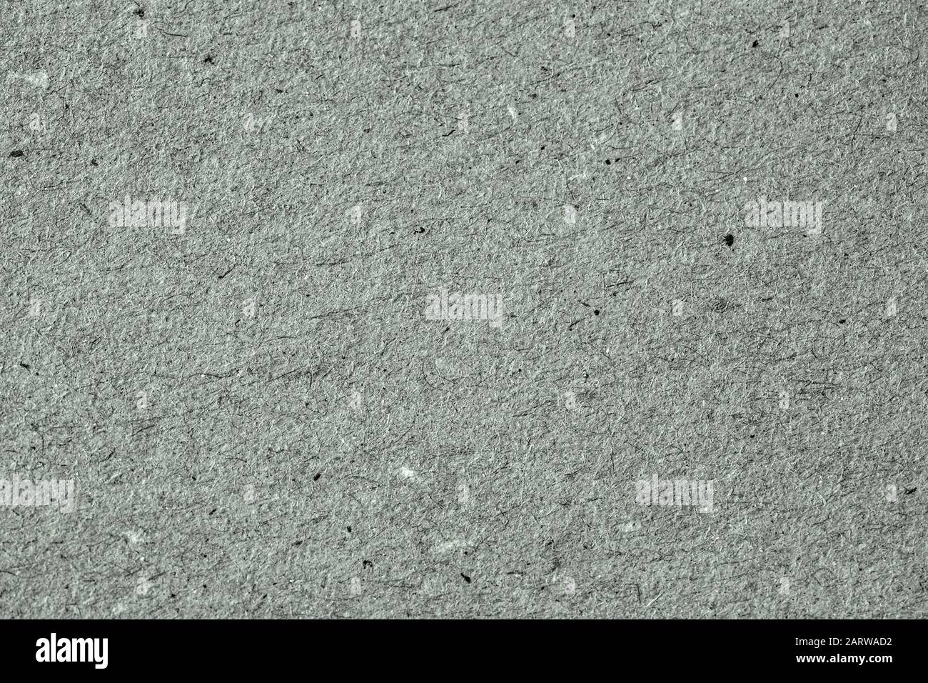 Grunge organische Pappe, natürliche Papieroberfläche, recycelbares Material, hat große Einschlüsse von Zellulose, verschiedenen Fasern, Flusen Stockfoto